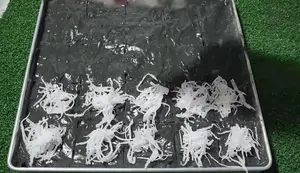 Ancient Black Khanom Pia Pun: A Traditional Coconut Rice Cake Recipe