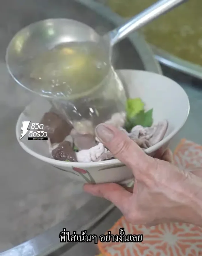 Add the bone broth to the pot.