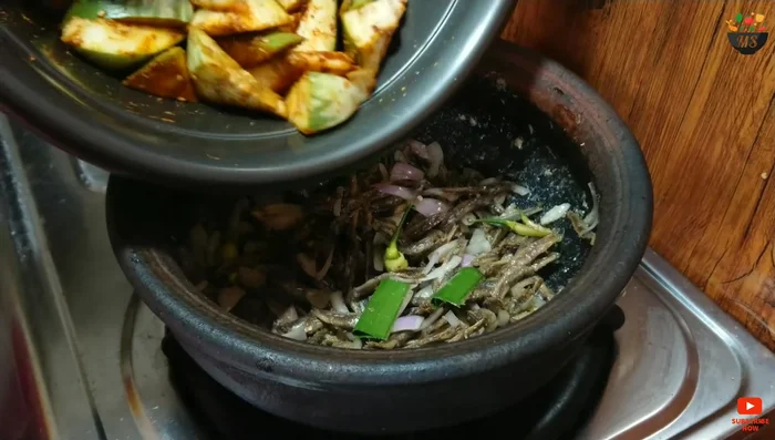 Simmer everything in the oil for a while.