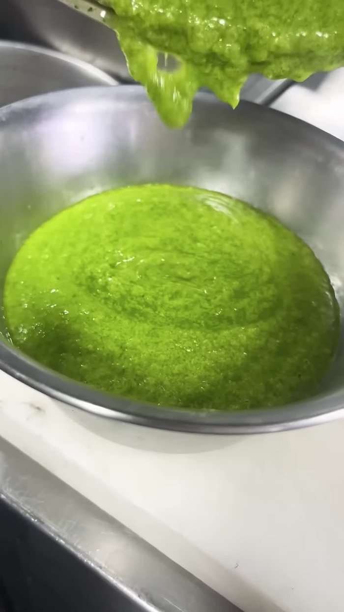 Make a fine paste of the boiled garlic and coriander stem using a mixer.