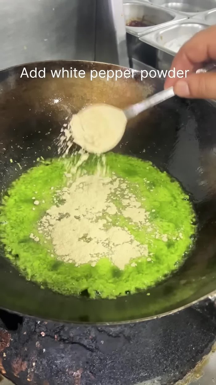 Add the paste to a pan along with pepper powder, white pepper powder, sauce, 1/2 spoon of salt, and matting powder. Cook on a slow flame for 5-6 minutes, adding a little oil for flavor.