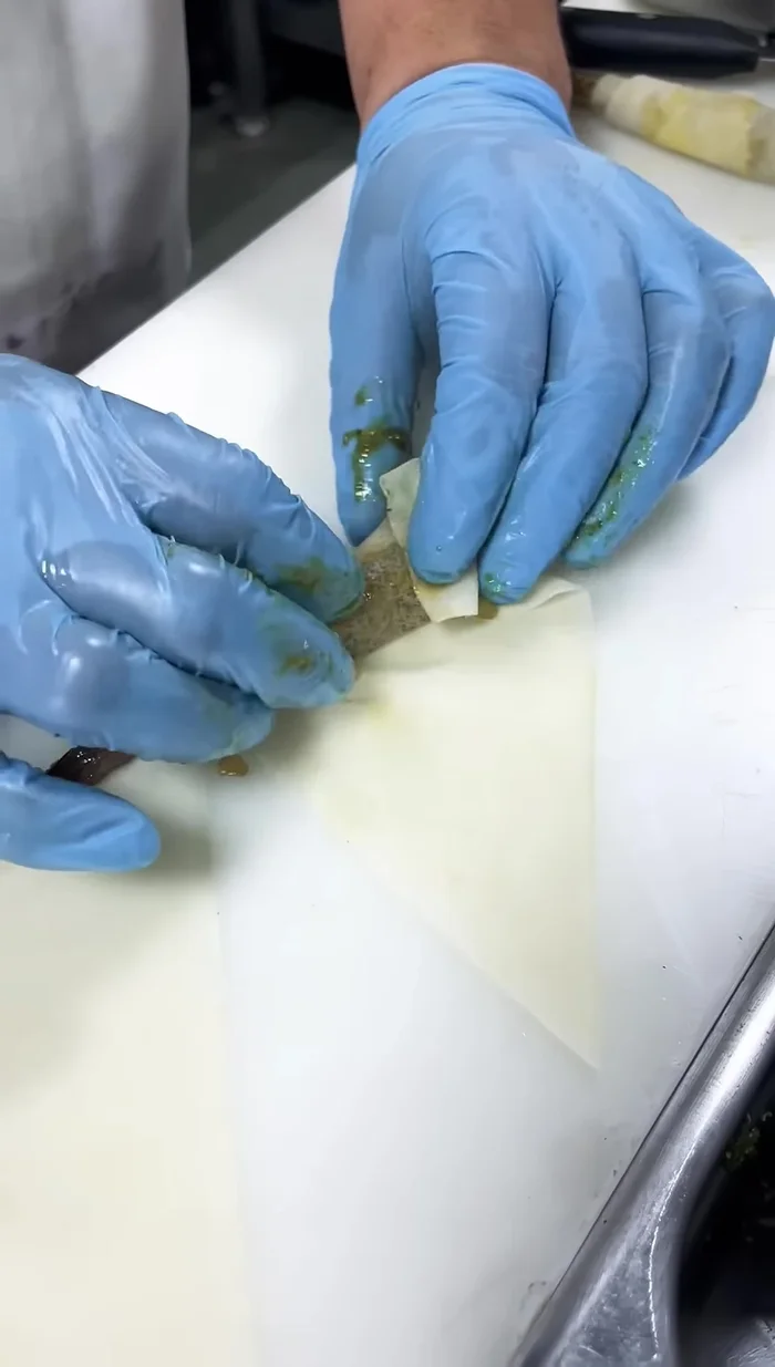 Wrap the spring rolls tightly. Use egg liquid (or flour liquid for vegetarian option) to seal the wrappers.