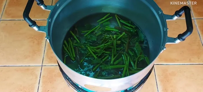 Blanch the morning glory in boiling water until cooked, then immediately transfer to cold water to stop the cooking process.