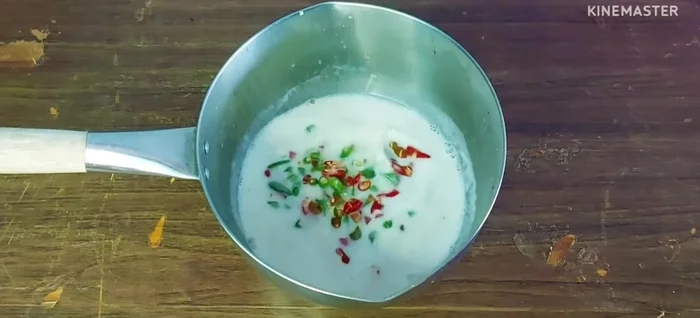 Add chopped chilies and shallots to the dressing.