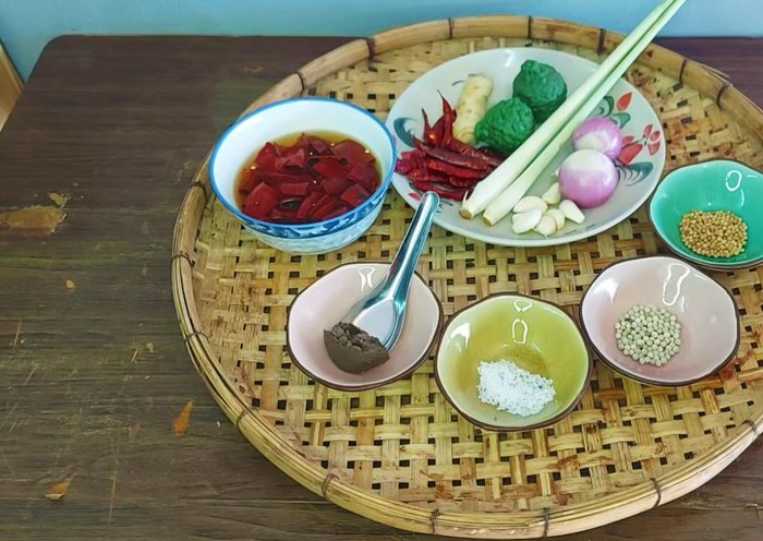 Prepare the red curry paste: Soak dried chilies in water to soften. Finely chop shallots, lemongrass, garlic, and lime peel.