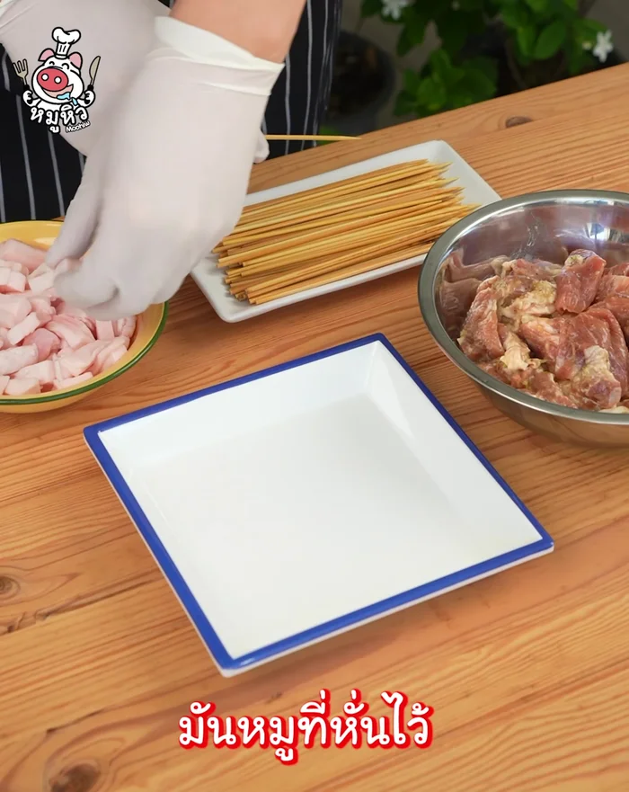 Thread the marinated pork onto skewers.
