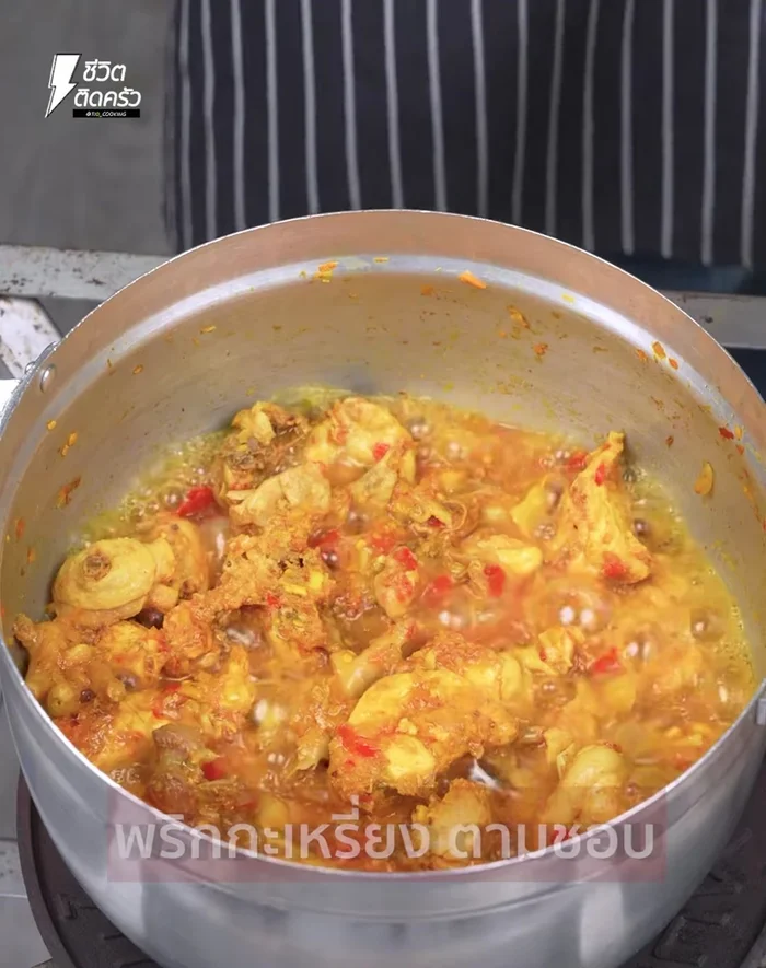 Open the pot, add chili peppers, kaffir lime leaves, and spring onions. Mix and cook until everything is heated through.