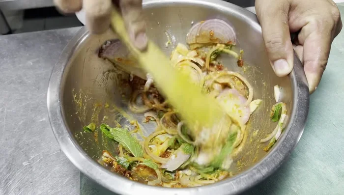Add the fried lotus root to the prepared sauce and gently mix.