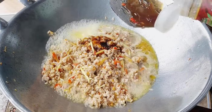 Add oyster sauce, light soy sauce, fish sauce, sweet soy sauce, seasoning powder, and a pinch of sugar.