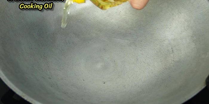Heat oil in a wok or large skillet over medium heat.
