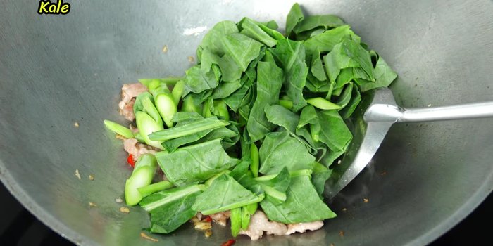 Add Chinese kale and stir-fry until wilted.