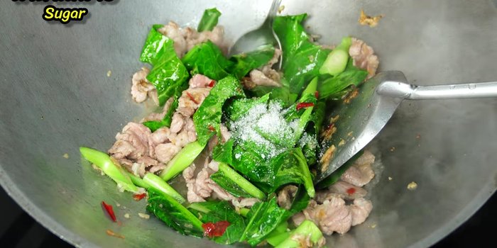 Season with sugar, fish sauce, oyster sauce, and black sesame seeds.