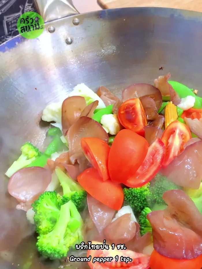 Add the mixed vegetable stir-fry sauce and ground pepper. Stir-fry well.