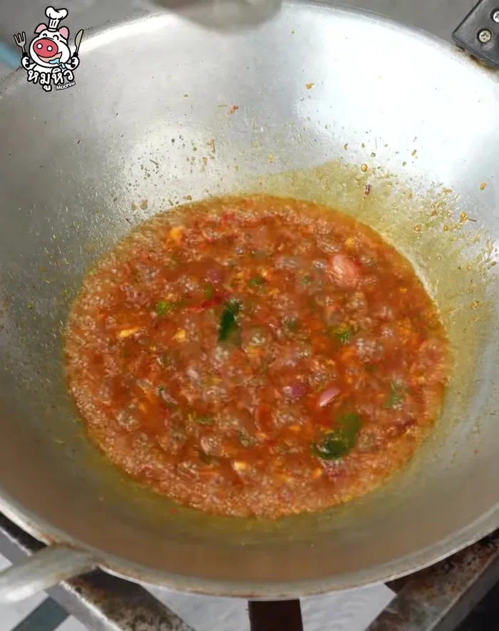 Add prepared apple snails and cherry clams to the pan. Simmer until cooked.