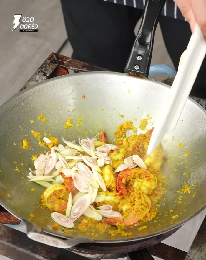Add chopped lemongrass and garden chili. Season with sugar, fish sauce, and seasoning powder.