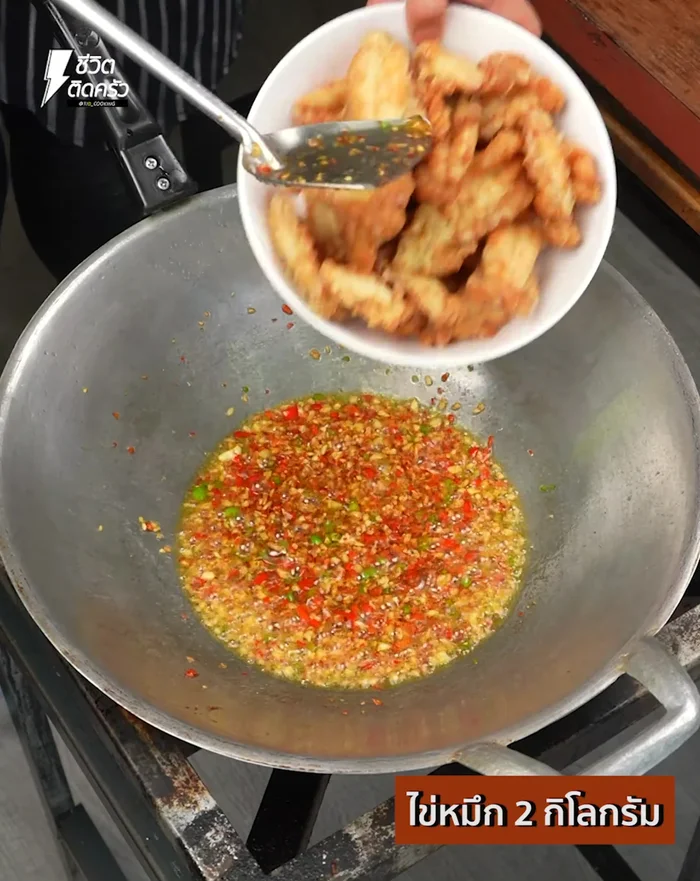 Add the fried squid eggs to the pan and stir-fry until everything is well combined and heated through.