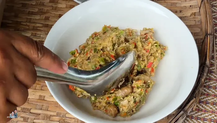 In a pan, combine 300ml of water, fish sauce, MSG, and sugar.