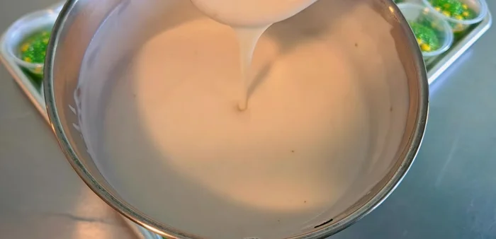 Pour the coconut cream topping over the corn sago mixture in the cups. Let it cool completely.