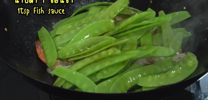 Increase heat. Add oyster sauce, fish sauce, white soy sauce, and sugar (adjust sugar to taste). Stir-fry until everything is cooked through.
