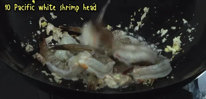 Add shrimp and stir-fry until they change color.