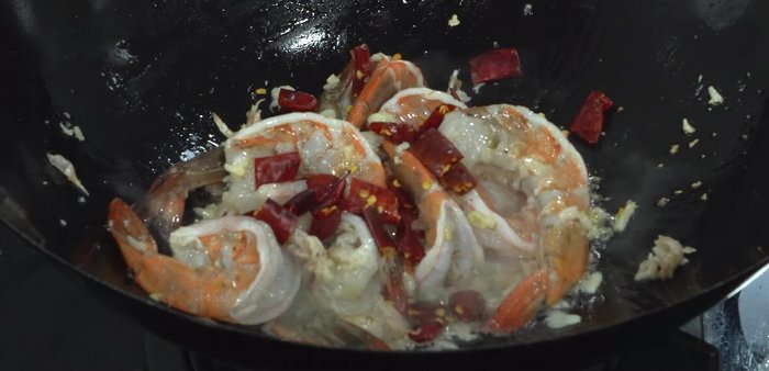 Sprinkle in more dried chilies (chopped).