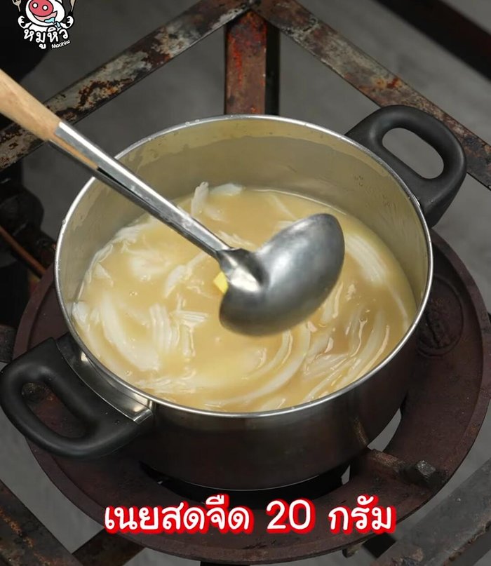 Add unsalted butter and mix until it melts. Then, add pandan leaves for fragrance. Stir continuously until done.
