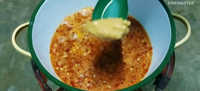 In a separate pot, add the curry paste, palm sugar, salt, curry powder, fish sauce, and tamarind juice. Stir until well dissolved.