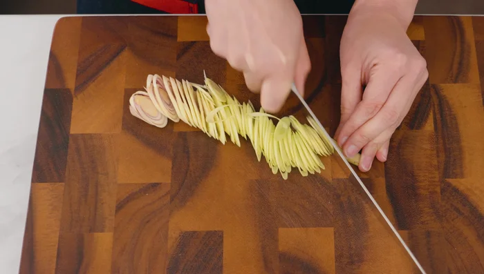 Prep the lemongrass: Thinly slice lemongrass on a diagonal. (148.319)