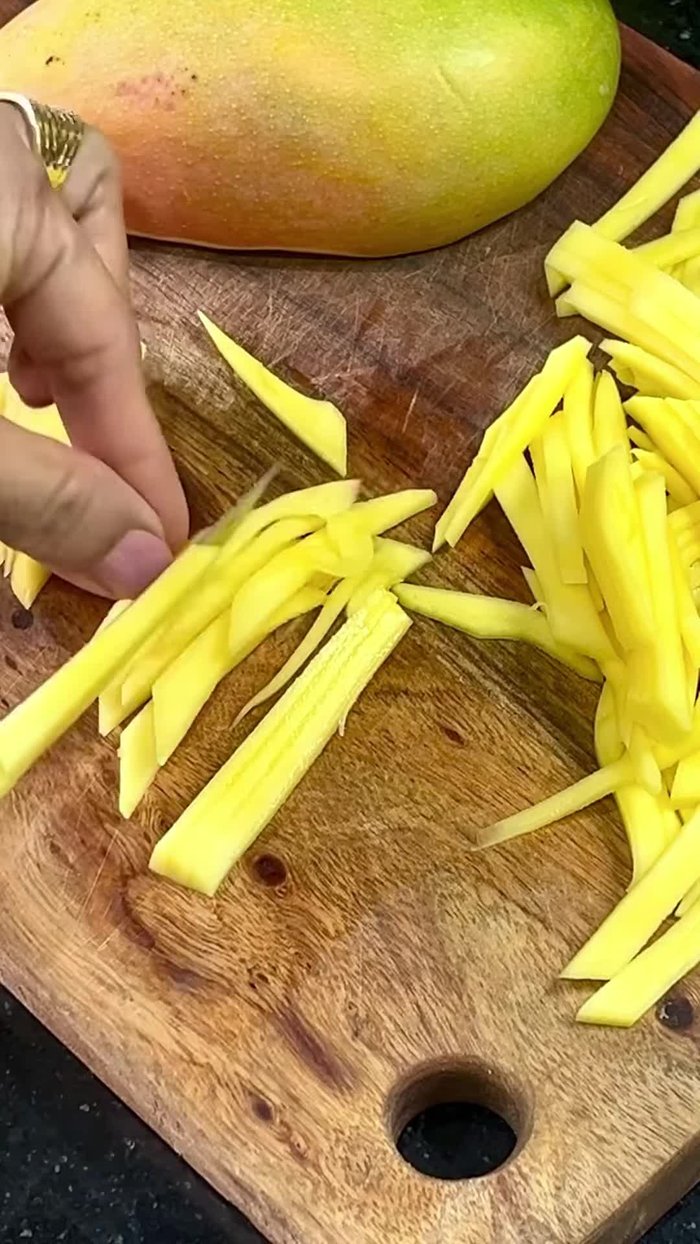 Cut the cucumber into thin, long slices.