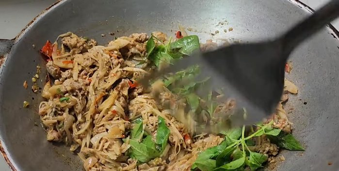 Add betel leaves and stir-fry until wilted.