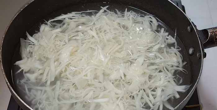 Boil pickled bamboo shoots for 5-10 minutes. Drain, rinse, and squeeze out excess water.