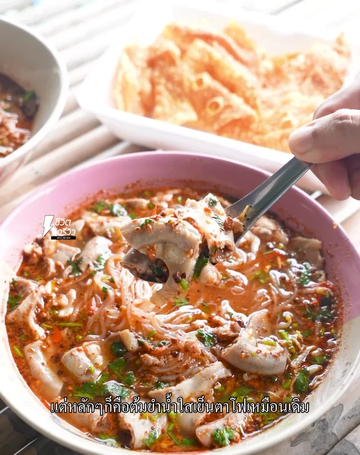 Prepare the broth: Start with a clear pork broth base. Add tom yum paste, fish sauce, sugar, and lime juice to taste. Adjust the sour and sweet levels according to preference.