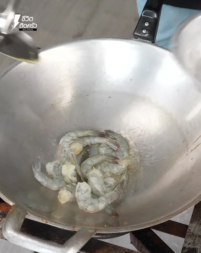 Add shrimp and sausage, stir-fry until cooked. Add onion and stir-fry.
