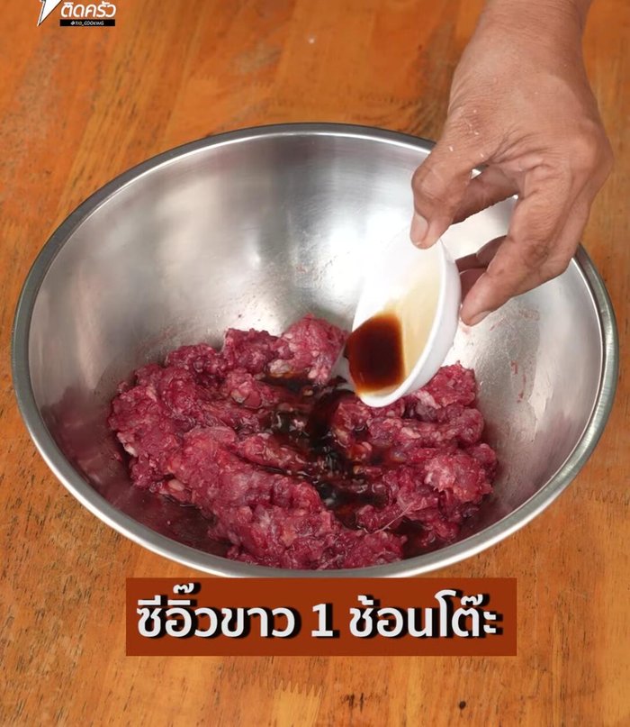 Season the pork mixture with soy sauce, white soy sauce, and sugar. Then, mix in oyster sauce.