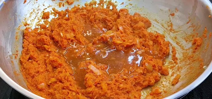 Add liquids and seasonings: Add diluted tamarind water, fish sauce, sugar, 1/3 of the salt, and tomato sauce. Stir until combined and some liquid evaporates.