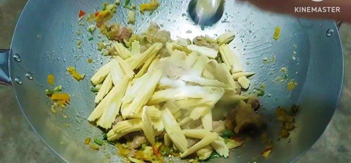 Add baby corn, sugar, seasoning powder, soy sauce, and white oil. Stir-fry until baby corn is cooked.