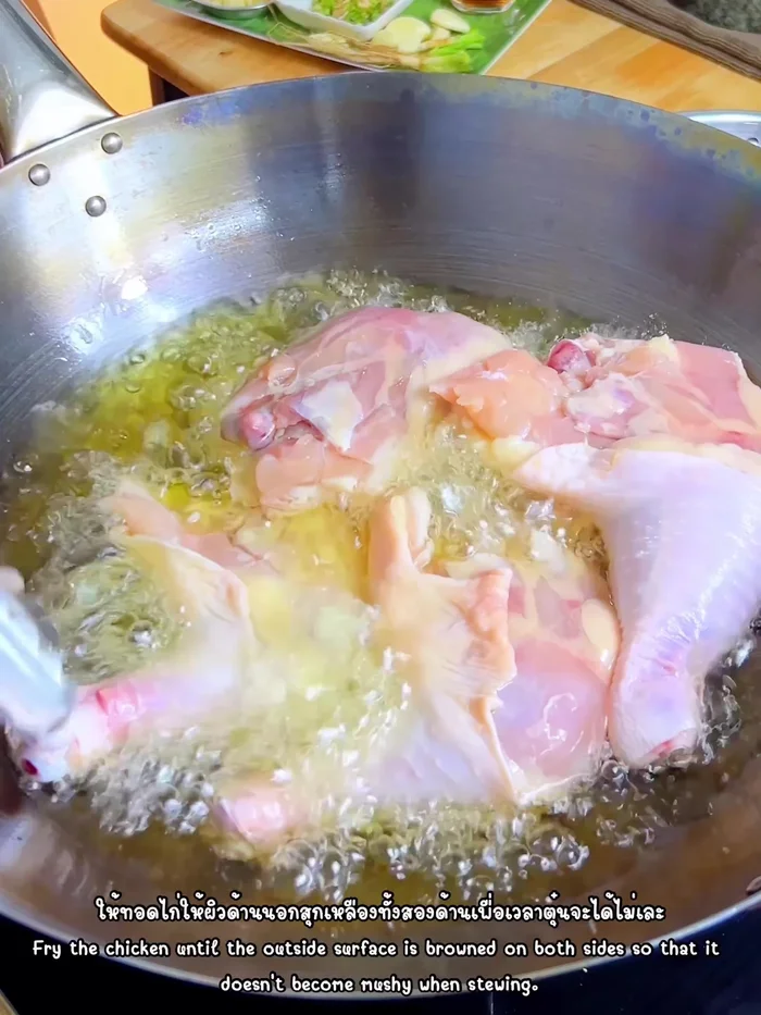 Fry chicken legs until golden brown on both sides. Drain oil.