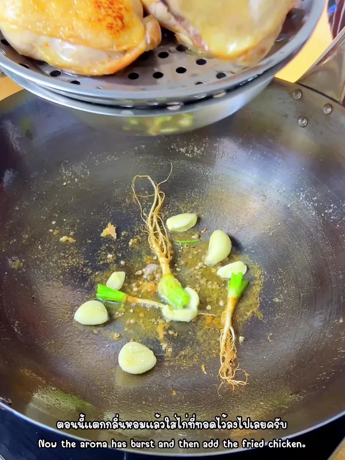 Add the fried chicken legs to the pan.