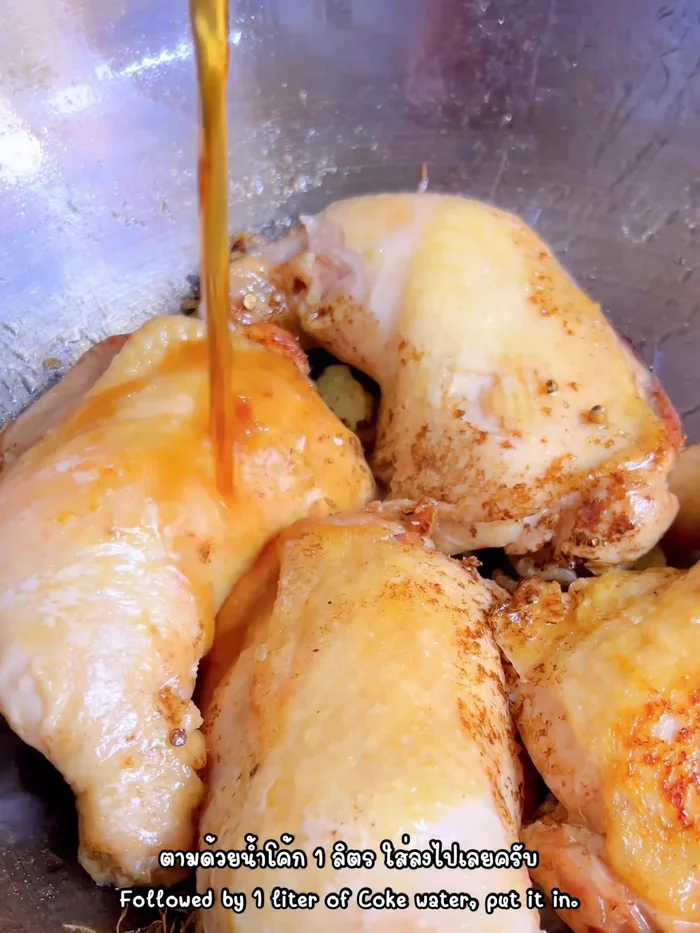 Pour in Coke, salt, white soy sauce, and oyster sauce.