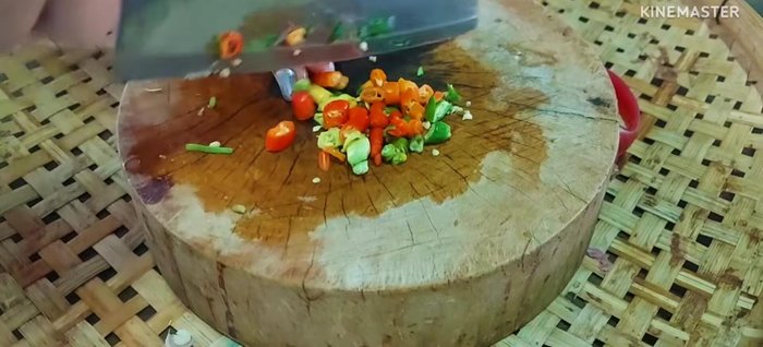 Add the chilies (Karen chili and chili pepper or red chili peppers).