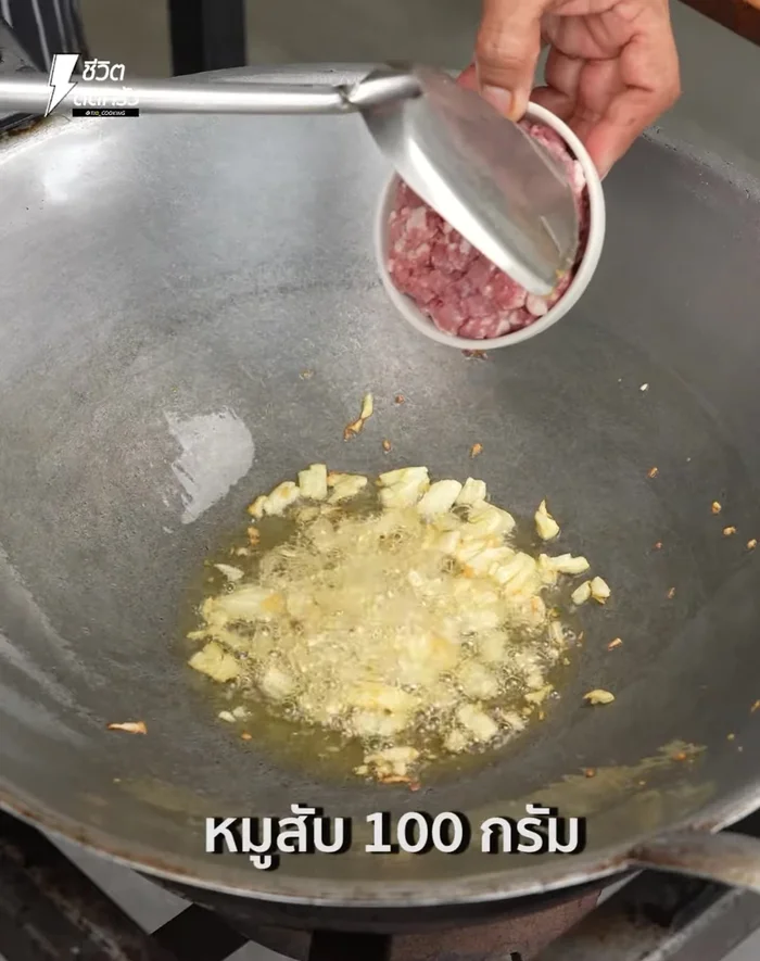 Add minced pork and stir-fry until cooked.