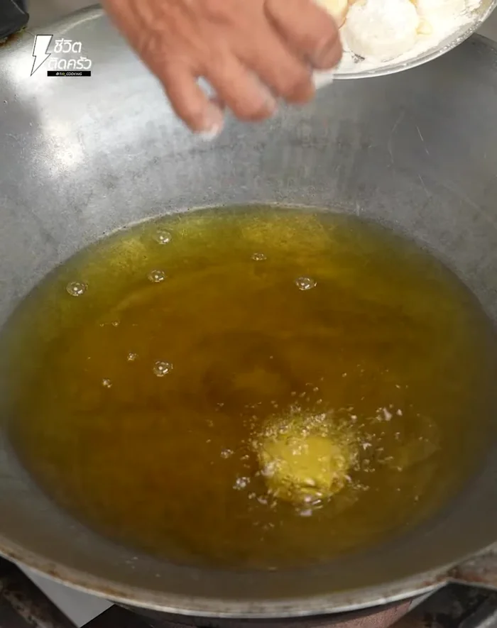 Heat a pan over medium heat with oil. Carefully fry the tofu pieces until cooked through, then remove and set aside to cool.