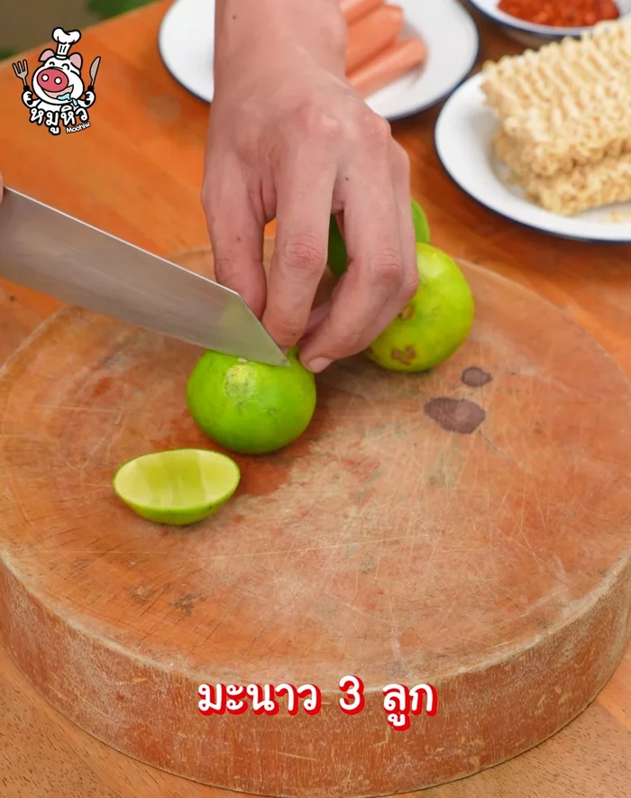 Cut the lemon into wedges. Set aside.