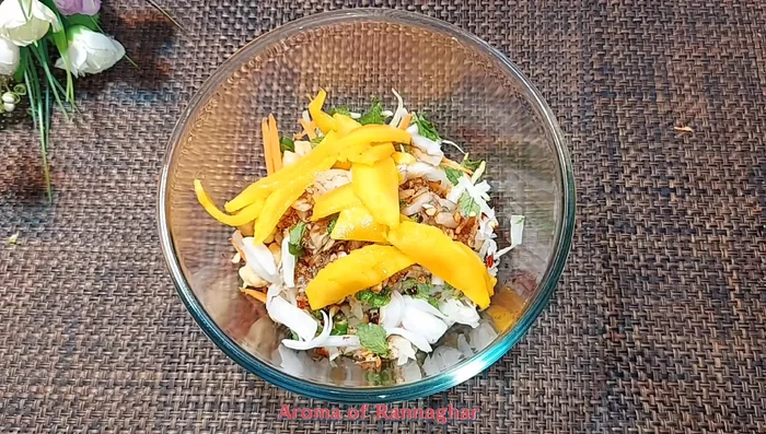 Add mangoes and almonds, and mix again gently.