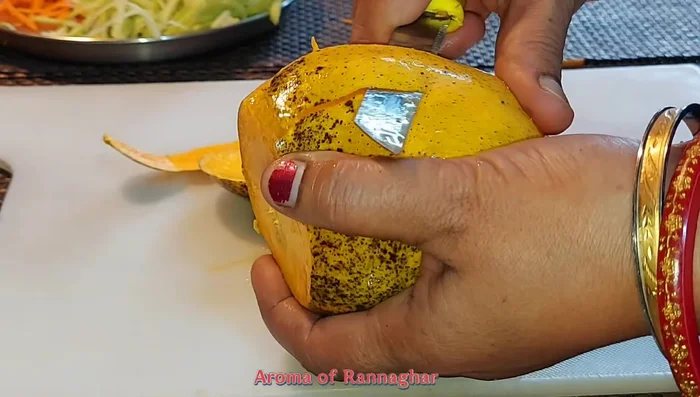 Cut mango into strips. Store all cut vegetables in the fridge for added crunch.