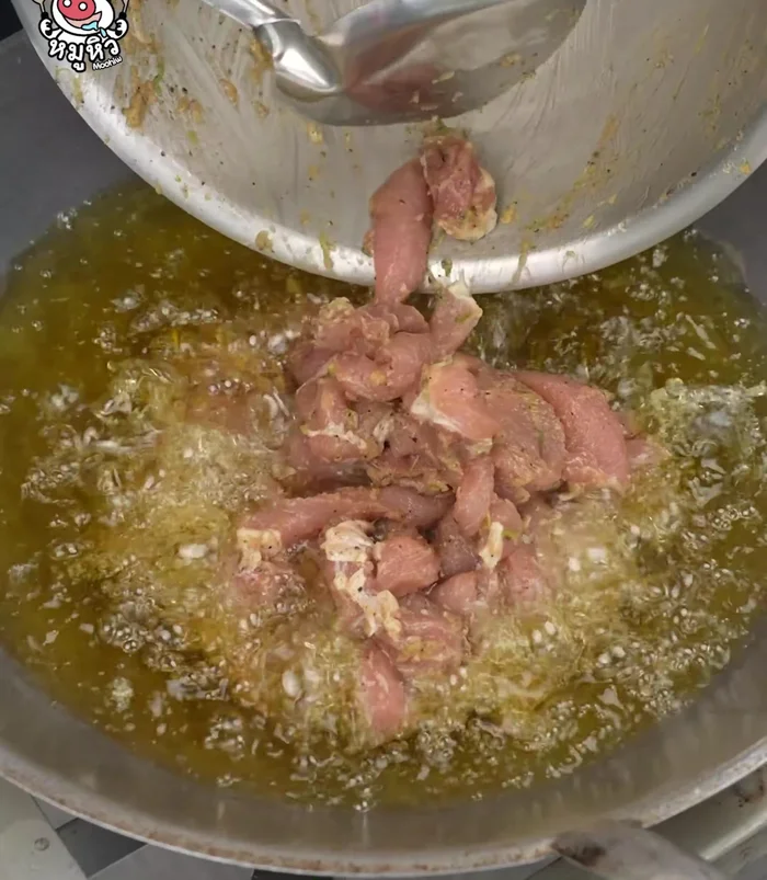 Fry the marinated pork evenly until cooked through.