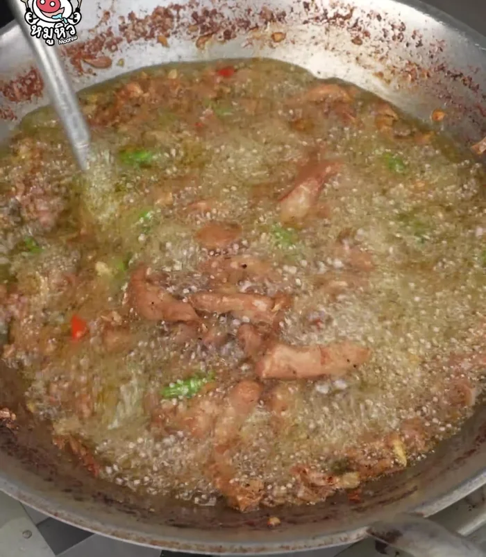 Continue frying until the pork is cooked and slightly browned. The chili peppers will add a fragrant smell.