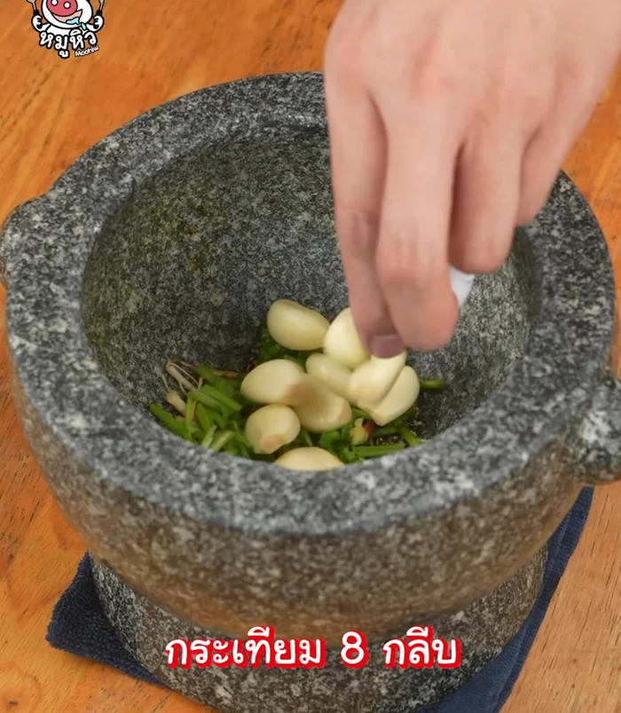Add garlic and pound it.