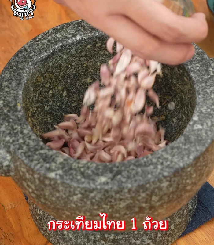 Pound Thai garlic (roughly or finely peeled).
