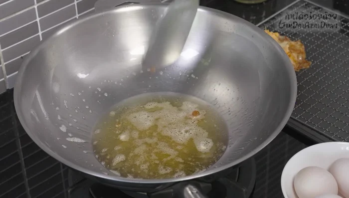 Remove the fried eggs from the pan and set aside. Drain excess oil.